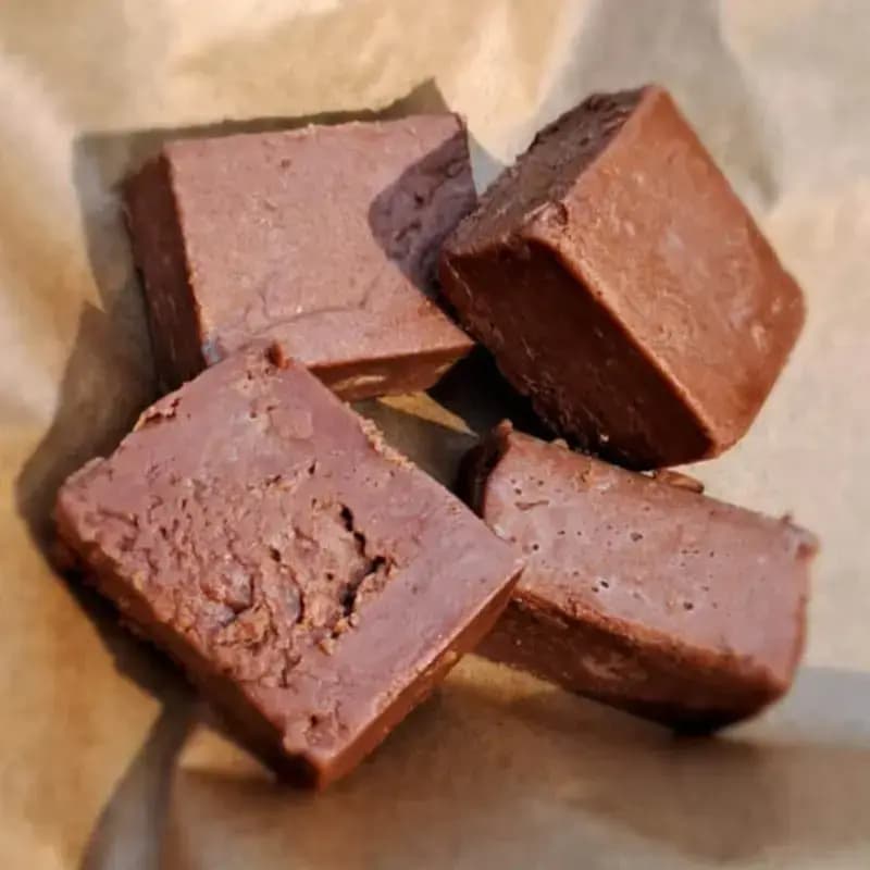 Chocolate fudge pieces with a rich, smooth chocolate texture